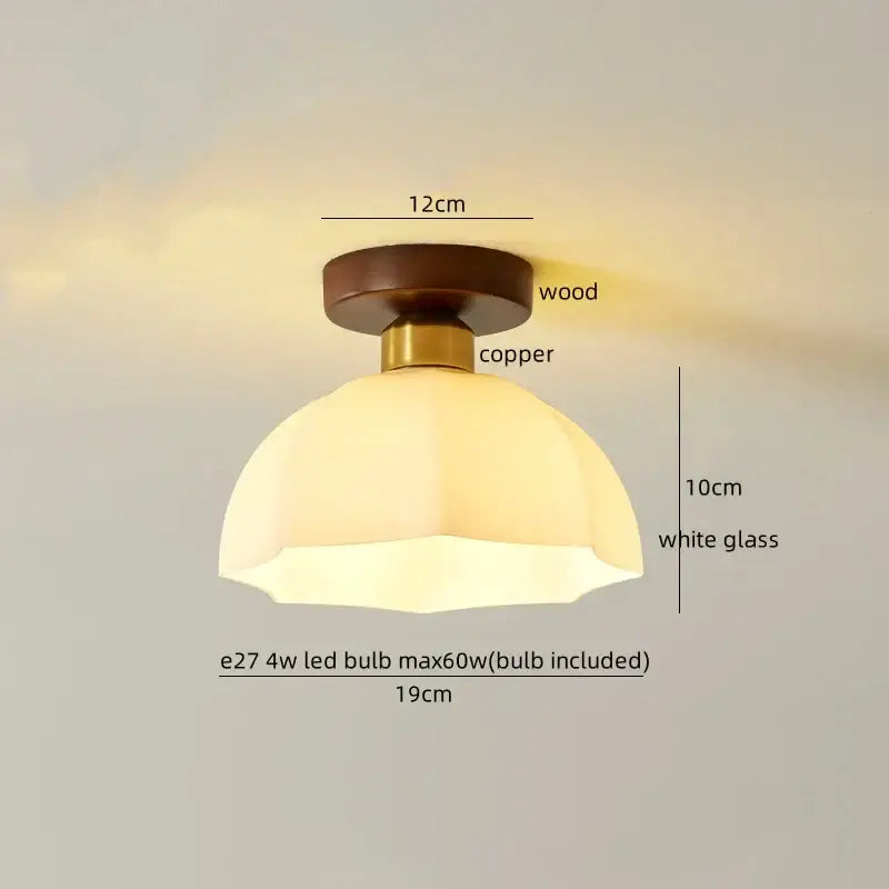 A warm-toned gold flower frosted glass ceiling lamp with octagonal cotton shape led and wooden copper fixture decorbites cotton shape