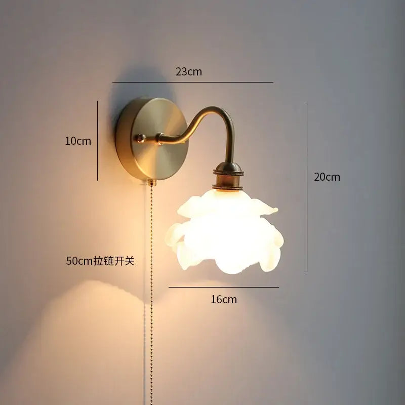 Antique brass wall sconce with gold fluted glass flower shade and 50cm pull-chain switch, ideal as a decorbites copper wall lamp