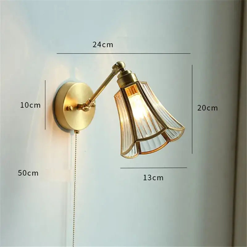 Brass-finished adjustable wall sconce with fluted translucent glass shade ideal as a decorbites copper wall lamp