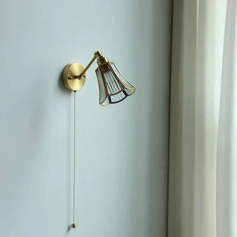 Gold fluted glass wall sconce with brass adjustable arm featuring fluted glass shade for bedroom wall lamp decorbites copper wall design