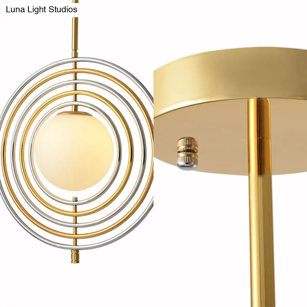 Gold Frosted Glass Orbit Pendant Light - Modern 1-Light Hanging Fixture for Dining Room with Concentric Rings