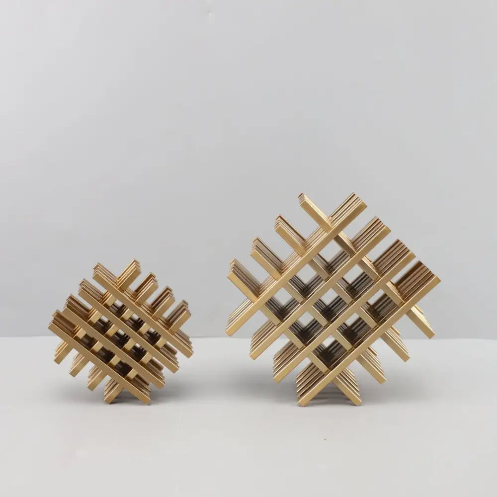 Gold geometric block metal bookends with intersecting slats forming a lattice pattern for living room decorbites decor