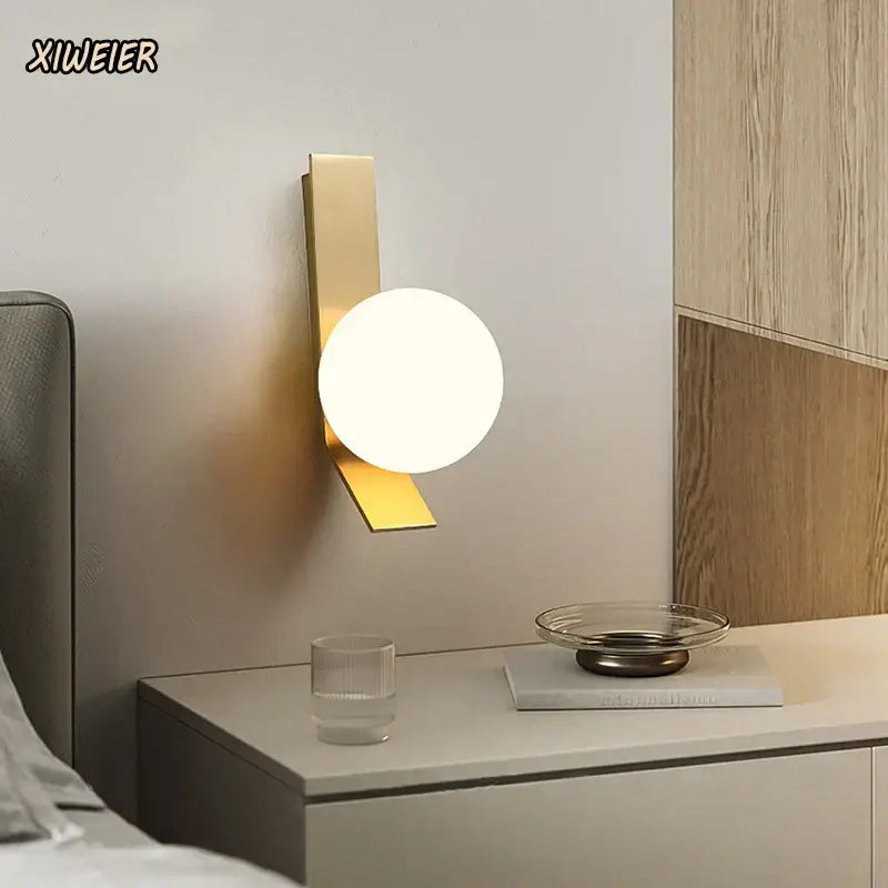 Gold-toned glass ball nordic wall lamp with sleek metal frame and frosted glass shade for living room decorbites wall lamp