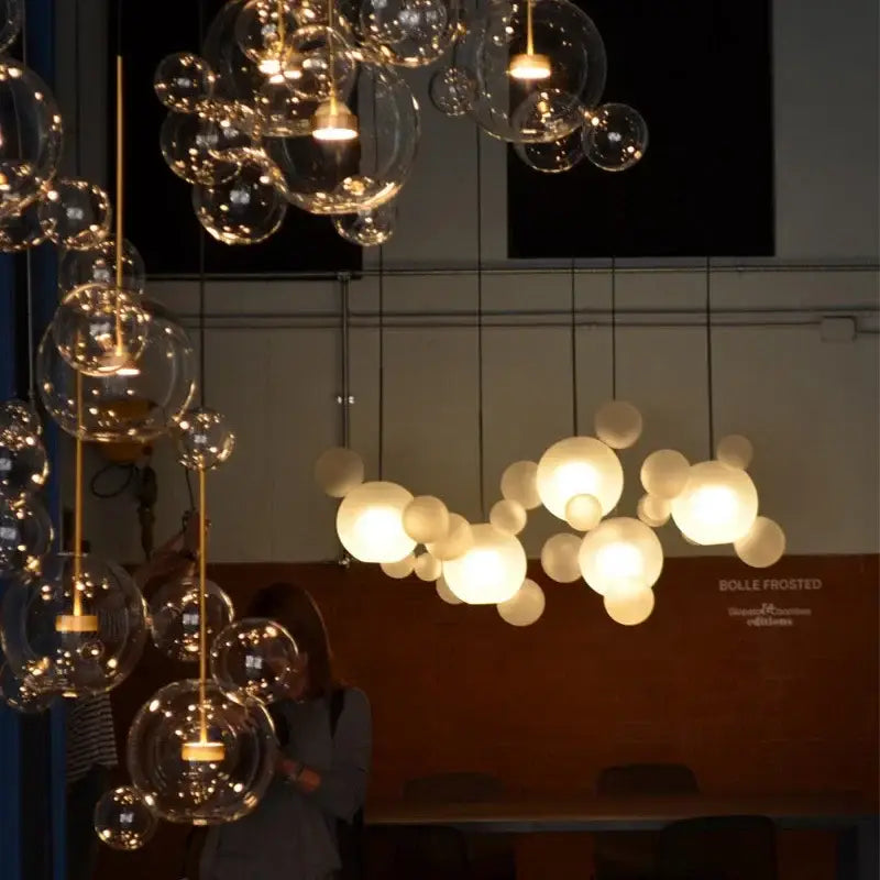 Gold glass bubble led chandelier with clear and frosted spherical bulbs and gold-toned rods decorbites glass bubble lighting
