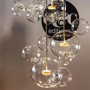 Gold glass bubble led chandelier with clear glass bubbles and gold-toned metal accents for dining room lighting decorbites glass bubble