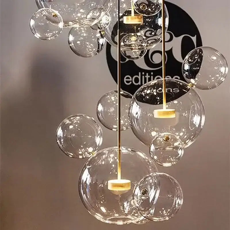 Gold glass bubble led chandelier with clear glass bubbles and gold-toned metal accents for dining room lighting decorbites glass bubble