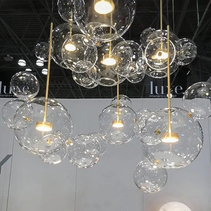 Gold glass bubble led chandelier with clear glass bubbles and gold-toned metal accents for dining room lighting decorbites glass bubble