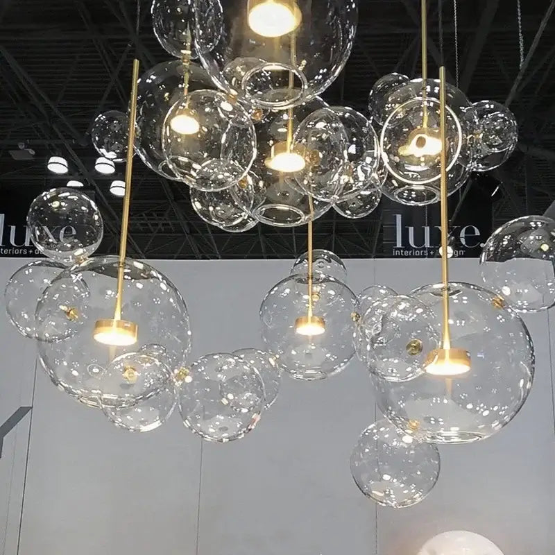 Gold glass bubble led chandelier with clear glass bubbles and gold-toned metal accents for dining room lighting decorbites glass bubble