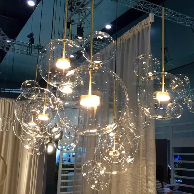 Gold glass bubble led chandelier with warm glowing bulbs and gold-toned metal fixtures for dining room lighting decorbites glass bubble