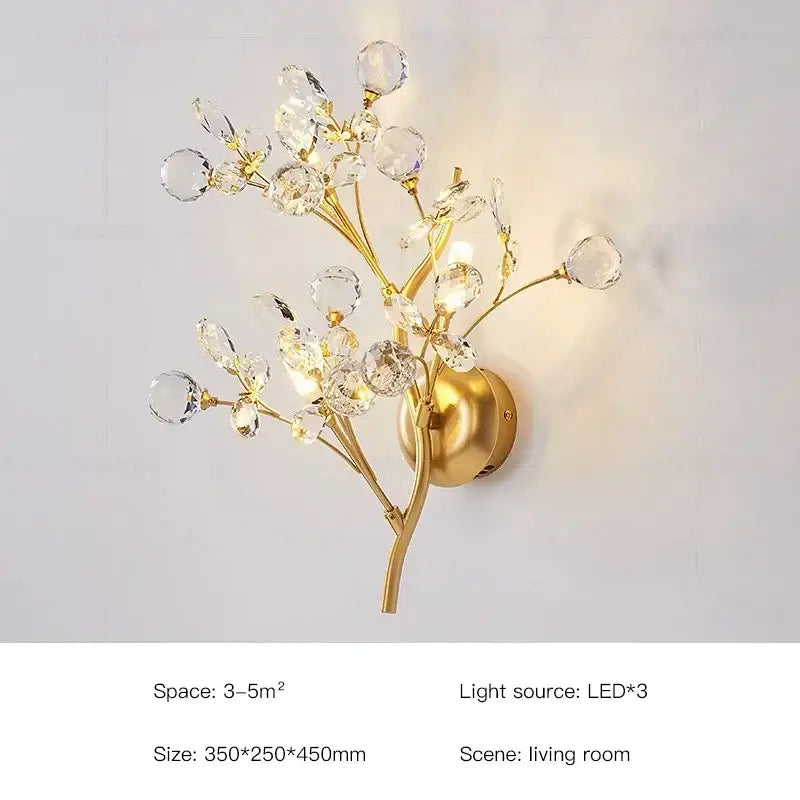 Gold-toned wall sconce with crystal embellishments shaped like a branching tree for a flower chandelier ceiling lamp