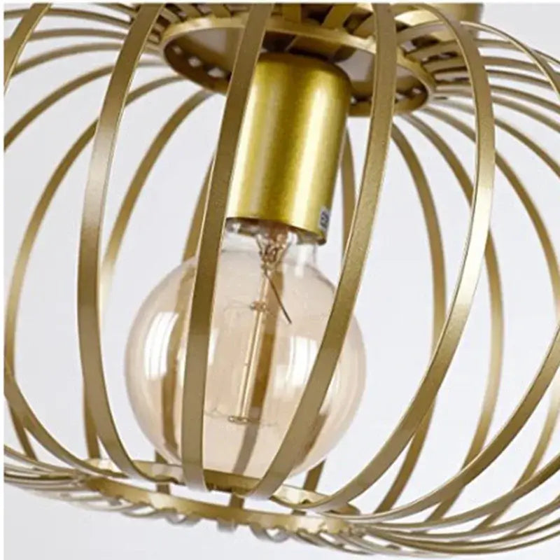 Gold iron art ceiling light with gold-toned metal cage pendant and clear glass bulb for living room decorbites iron art