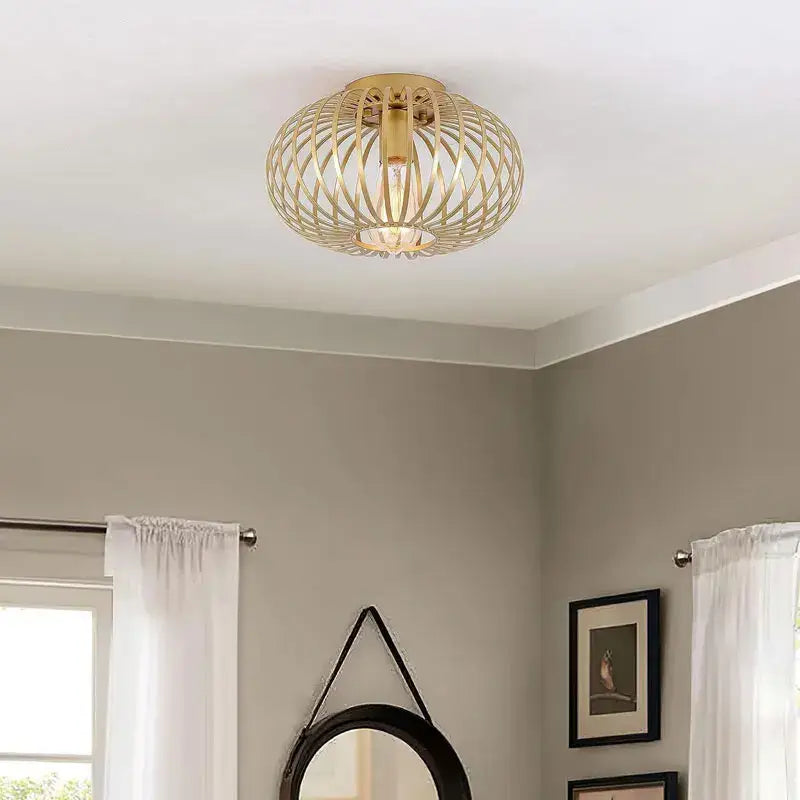 Gold-toned iron art ceiling light with woven cage design and visible bulb ideal for living room decorbites iron art decor
