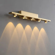 Gold finished iron art mirror wall sconce with five adjustable spotlights casting warm focused beams by decorbites iron art