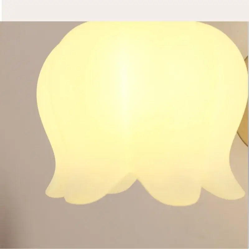 Gold iron led wall sconce with soft yellow translucent tulip-shaped lampshade and pull chain for hallway decorbites iron led