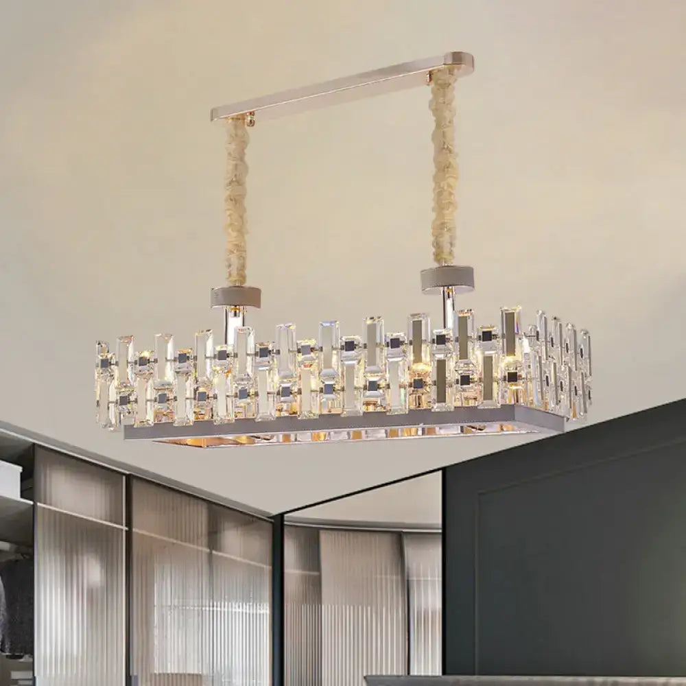 A contemporary rectangular hanging decorbites 12-bulb gold island light with clear crystal blocks and chrome frame