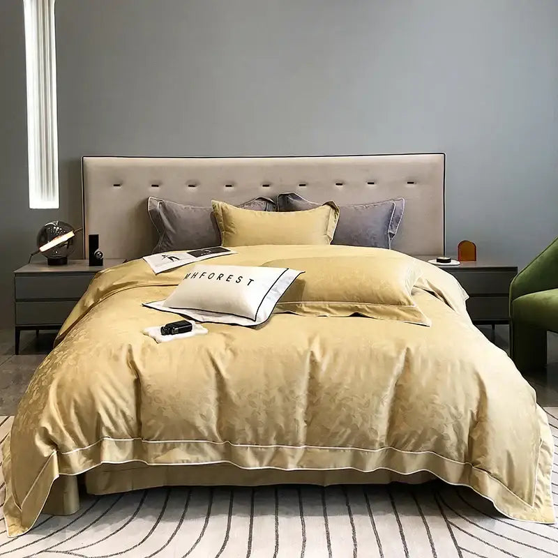 Gold-toned satin duvet cover bedding set with subtle floral embroidery and matching pillowcases in decorbites jacquard satin and egyptian cotton patchwork style