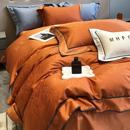 Orange satin bedding set with subtle paisley embroidery and dark gray piping in decorbites jacquard satin and egyptian cotton patchwork