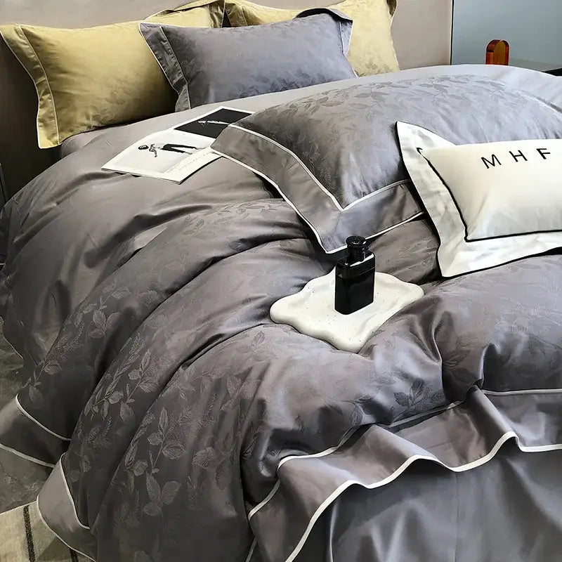 Gray satin-like bedding set with subtle leaf embroidery and white piping in decorbites jacquard satin and egyptian cotton patchwork