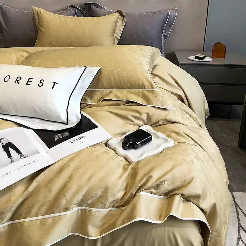 Cream-colored satin bedding set with subtle leaf embroidery and white piping in decorbites jacquard satin egyptian cotton patchwork