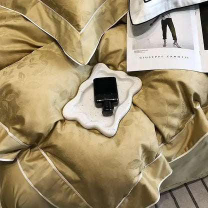 A sleek black perfume bottle on a white ceramic tray complements gold jacquard satin egyptian cotton patchwork bedding set decorbites
