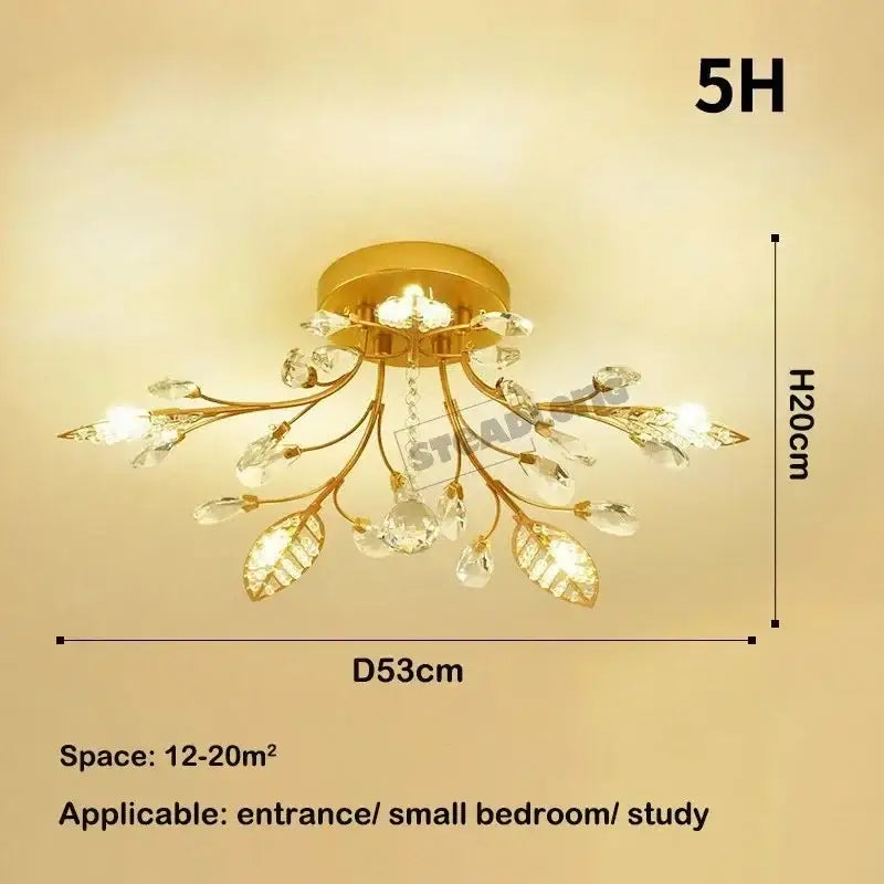 Gold-toned decorbites crystal ceiling chandelier with leaf and branch design featuring clear faceted crystals