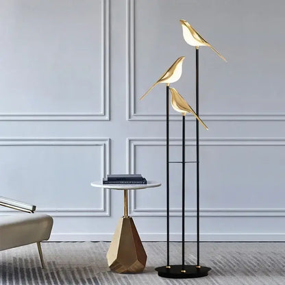 Gold led bird desk lamp with sleek modern design and illuminated figures on black poles for bedroom and living room decorbites led bird