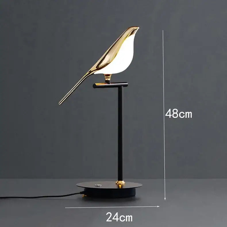 A sleek gold and white decorbites led bird desk lamp with a minimalist black stand for bedroom and living room decor