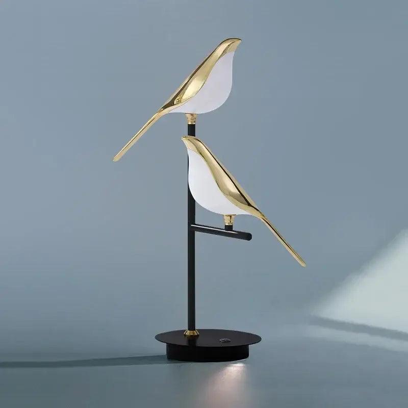 Gold led bird desk lamp with sleek metallic finish in gold and white for bedroom and living room decorbites led bird lighting
