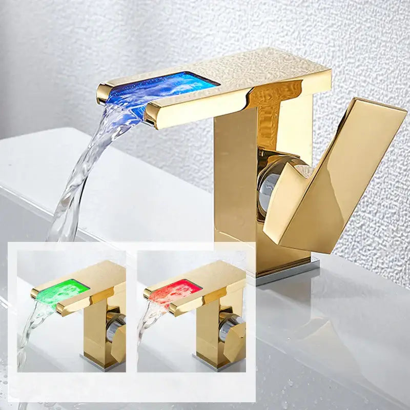 Gold led waterfall basin faucet with textured rectangular spout and blue illuminated water flow decorbites led waterfall tap