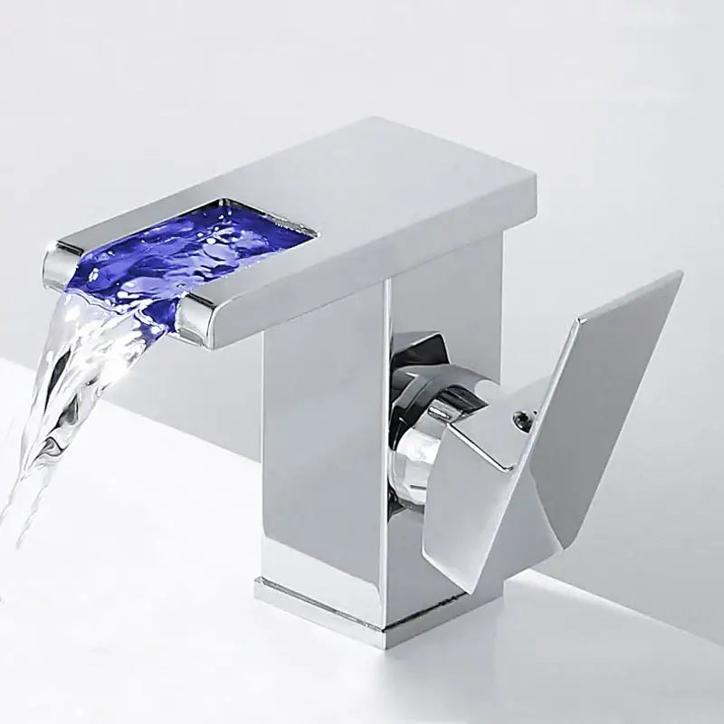 Chrome-finished decorbites led waterfall basin faucet with rectangular spout and blue glass panel for bathroom use