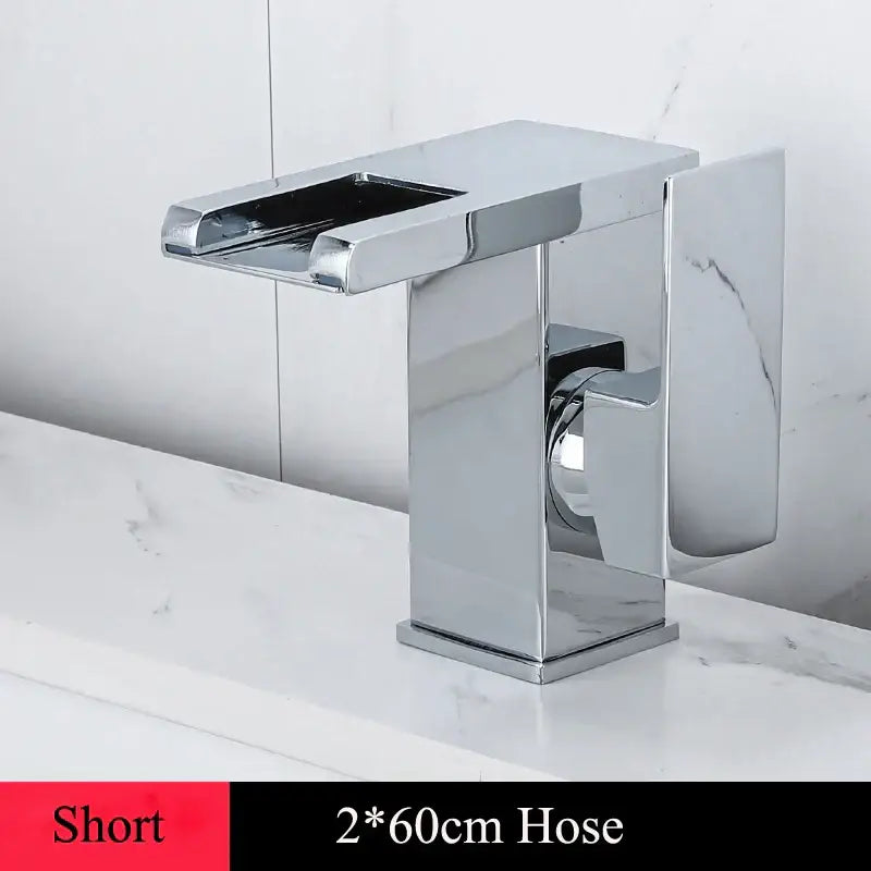 Modern chrome-finished basin faucet with sleek rectangular design and integrated handle for decorbites led waterfall basin use