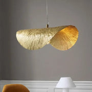 A sculptural gold lotus leaf led chandelier with textured design hangs for living room dining kitchen island decorbites gold lotus