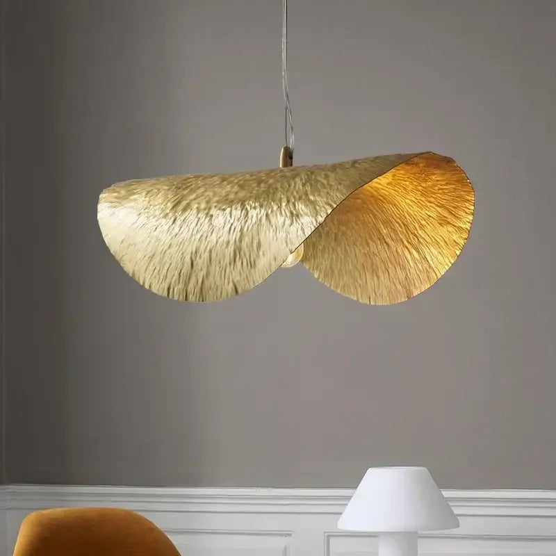 A sculptural gold lotus leaf led chandelier with textured design hangs for living room dining kitchen island decorbites gold lotus