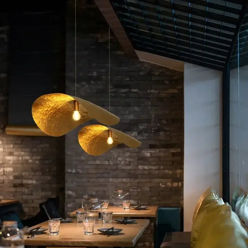 Two golden hammered metal pendant lights with a lotus leaf led design hang for living room dining kitchen decorbites gold lotus