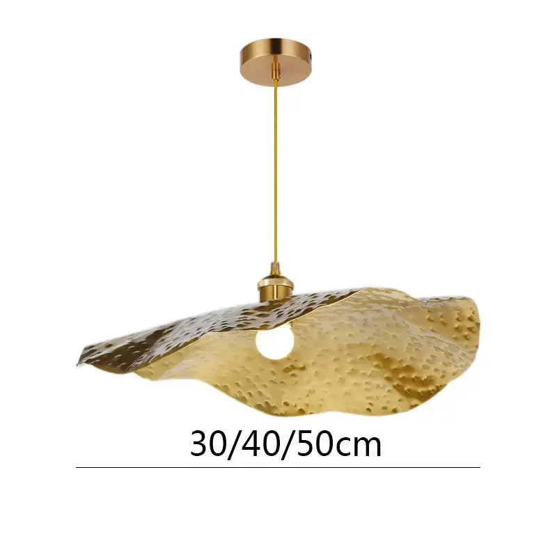 Gold-toned hammered metal lotus leaf pendant light with textured surface for living room decor by decorbites gold lotus