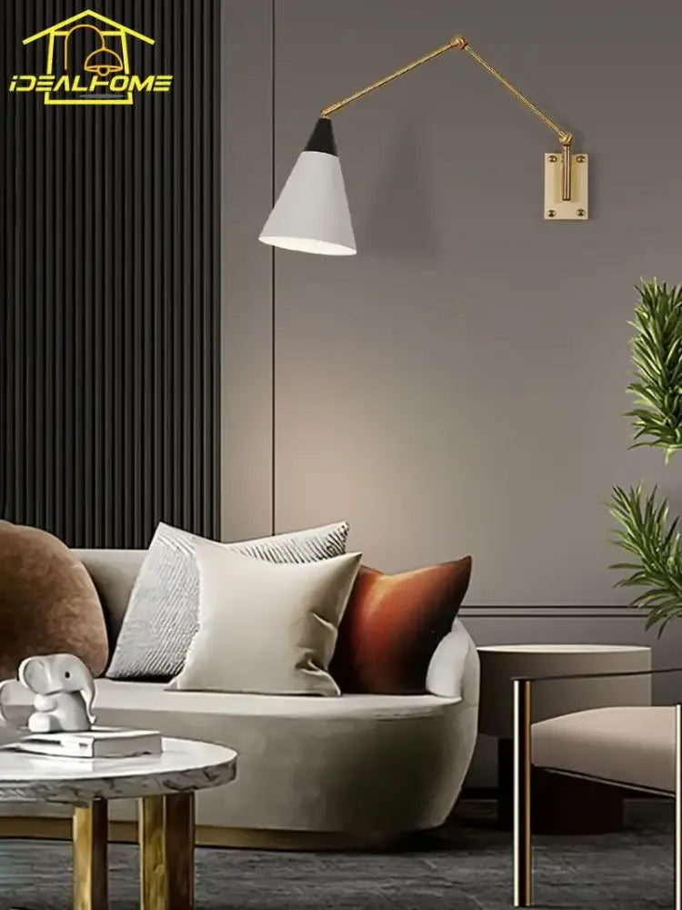 Gold lustre brass swing arm wall lamp with white conical shade and black accent for bedroom by decorbites gold lustre