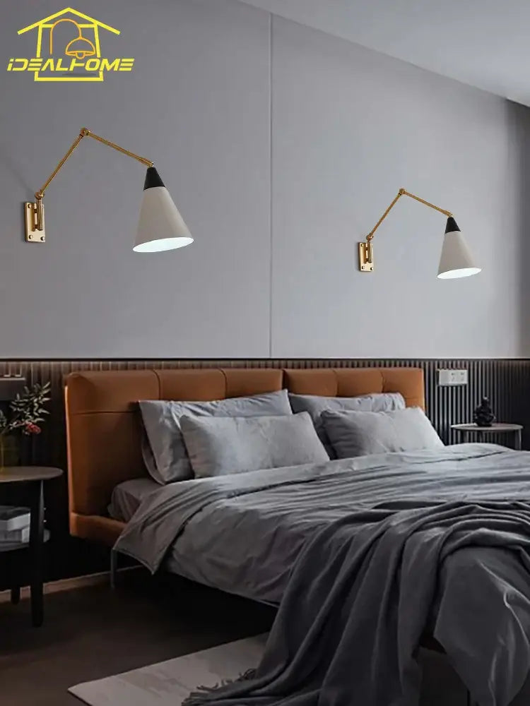 Gold lustre brass swing arm wall lamp with white conical shade and black accents for bedroom decor by decorbites