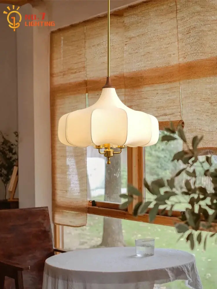 Cream-colored petal-shaped decorbites gold lustre medieval brass pendant lights with soft glow for dining room decor