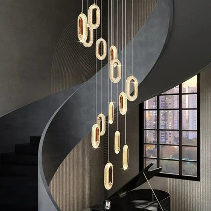 Gold lustre oval acrylic chandelier with sparkling textured surface and sleek metallic finish for dining room decorbites gold lustre