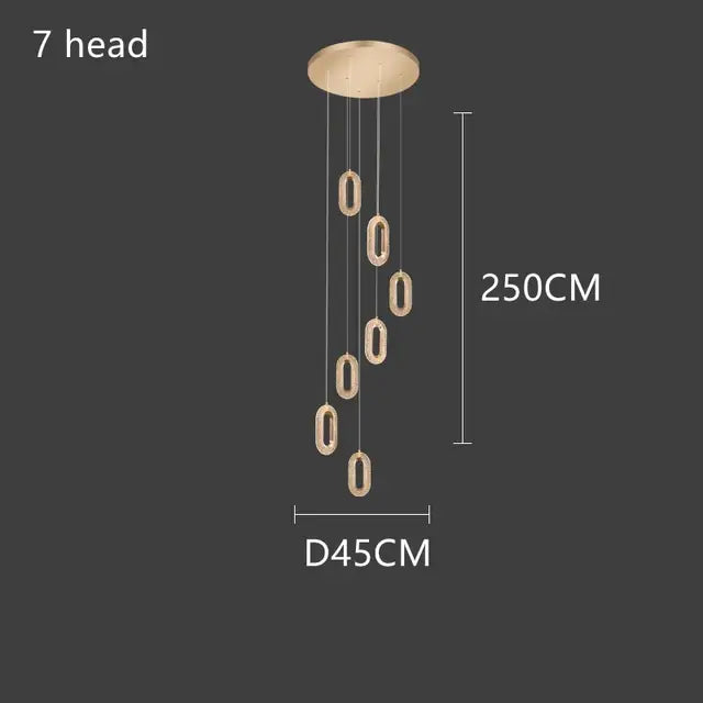 A decorbites gold lustre 7-head pendant chandelier with brushed gold finish and oval acrylic light fixtures for dining room