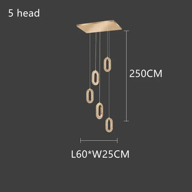 A modern decorbites gold lustre oval acrylic chandelier with five crystal-encrusted lamp heads for dining room pendant light