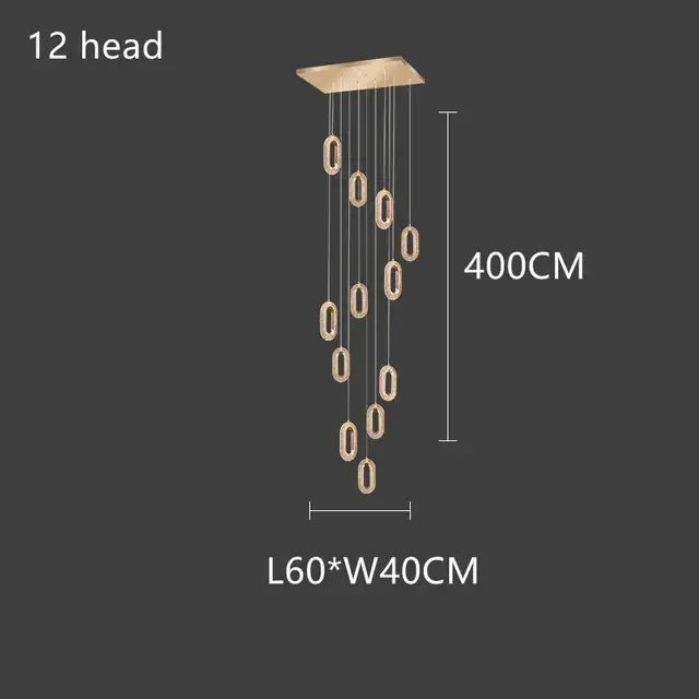 A modern decorbites gold lustre 12-head dining room pendant light with oval acrylic fixtures and gold finish mount
