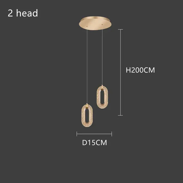 Gold-toned lustre oval acrylic chandelier with textured sparkling surface and two hanging lights for dining room decorbites gold lustre