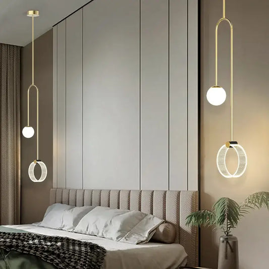 Gold luxury led pendant light with gold-toned spherical and ring-shaped glass shades for bedroom decorbites decor