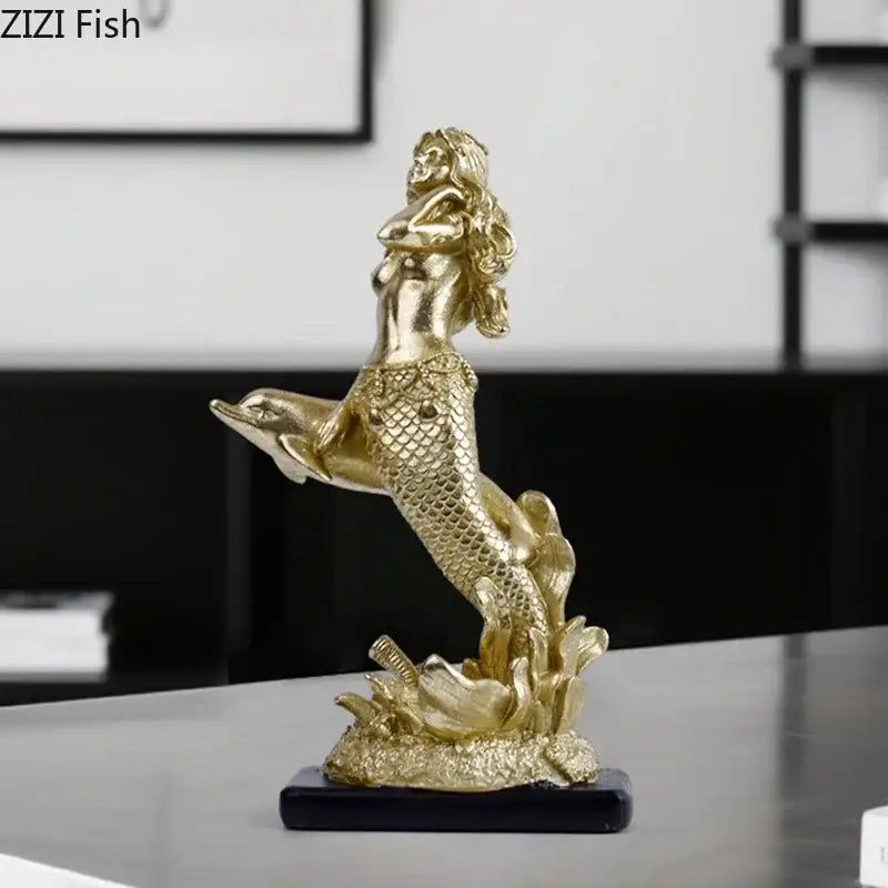 Golden mermaid statue resin sculpture with detailed scales and flowing hair standing atop a dolphin ornament