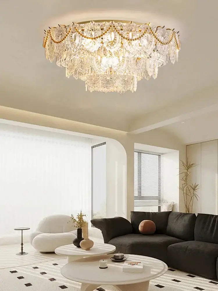 Luxurious gold pearl pendant chandelier with crystal leaf decor featuring a gold-toned frame and cascading clear glass pieces
