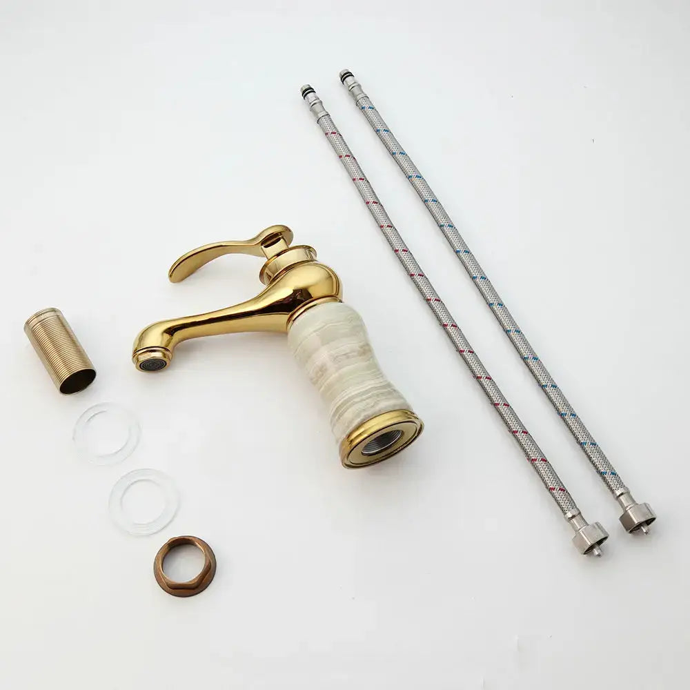 Gold plated jade bathroom faucet with single handle gold finish and marble patterned ceramic base with matching brass fittings