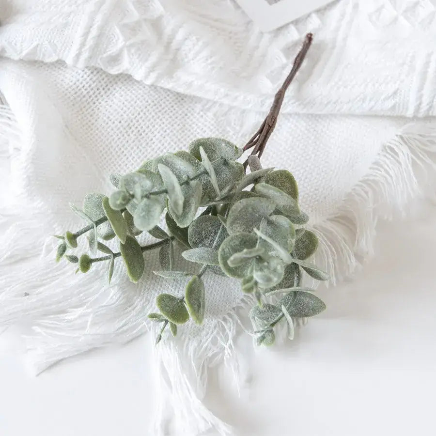 Faux eucalyptus branch with soft frosted green leaves and brown stem from decorbites eucalyptus leaves artificial plants decor