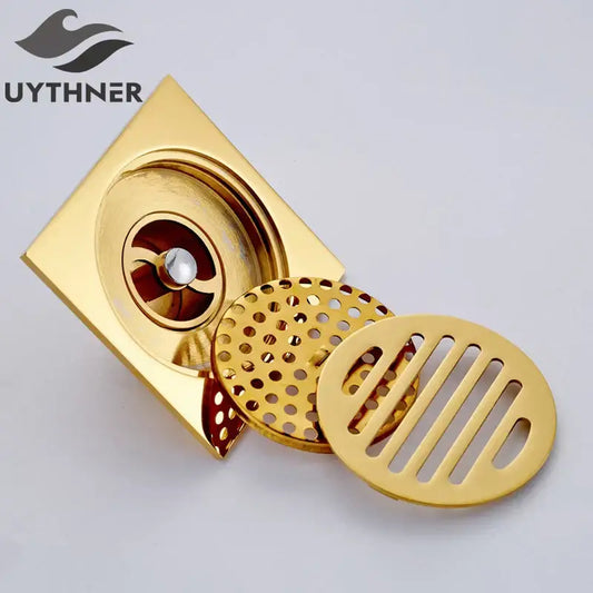 Gold square bathroom shower drain with interchangeable circular perforated and slotted grates by decorbites gold square