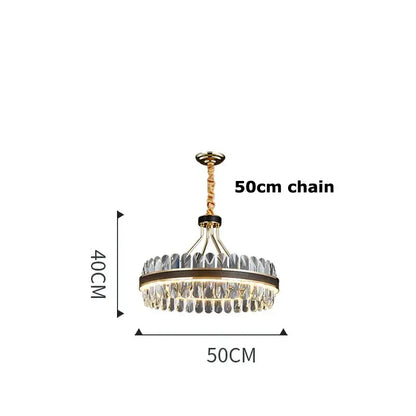 A modern gold stainless steel crystal chandelier with clear droplets and illuminated center for dining room decorbites gold stainless